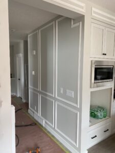 Accent wall in Calgary living room making space feel larger with custom paneling