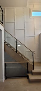 Board and batten accent wall installation in Calgary home by Calgary Custom Concepts