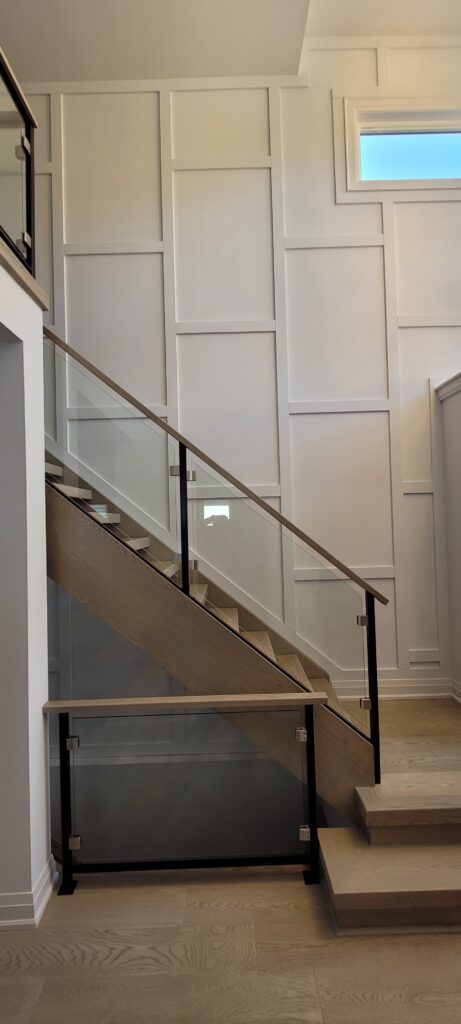 Board and batten accent wall installation in Calgary home by Calgary Custom Concepts