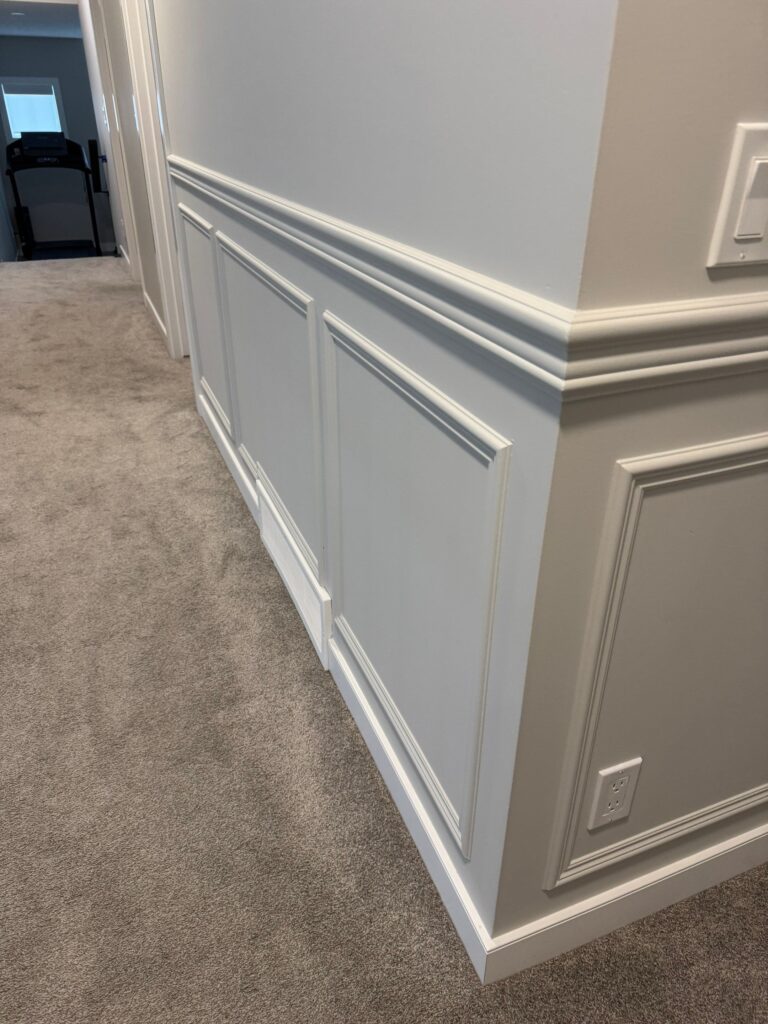 Wainscoting installation in Calgary living room custom home transformation