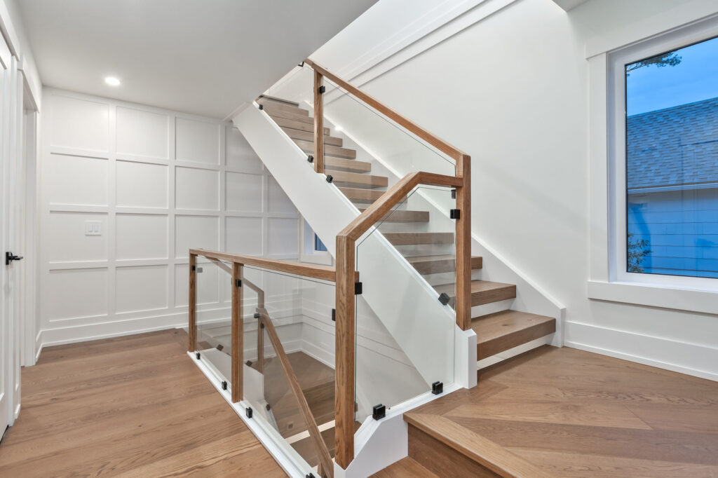Custom walk-in closet with shaker panelling in Calgary home by Calgary Custom Concepts