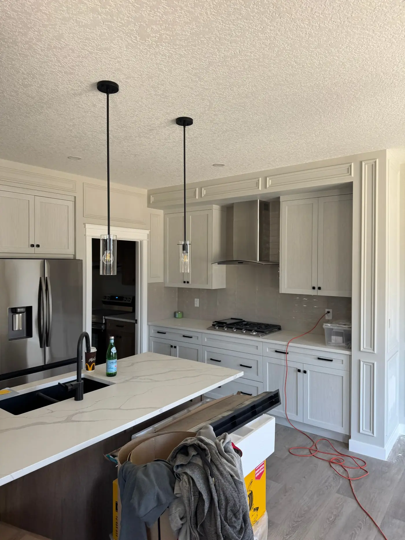 Kitchen cabinetry and applied panel moulding during the Creekstone whole-home upgrade.