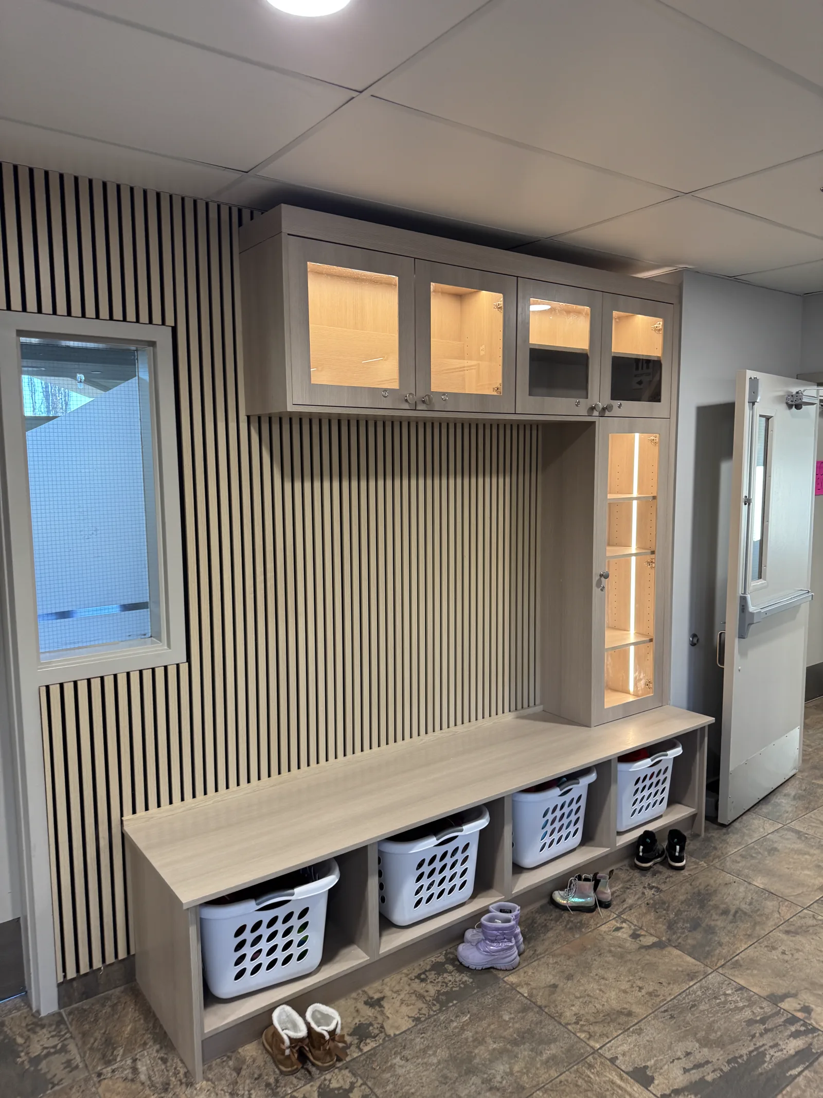 Custom illuminated cabinetry and wall panelling installation in Calgary