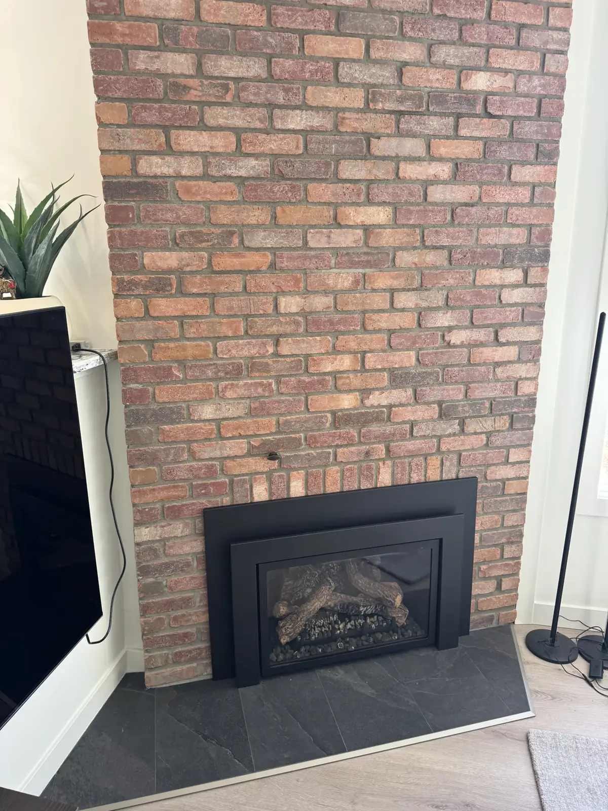 Completed brick fireplace detail in Point McKay