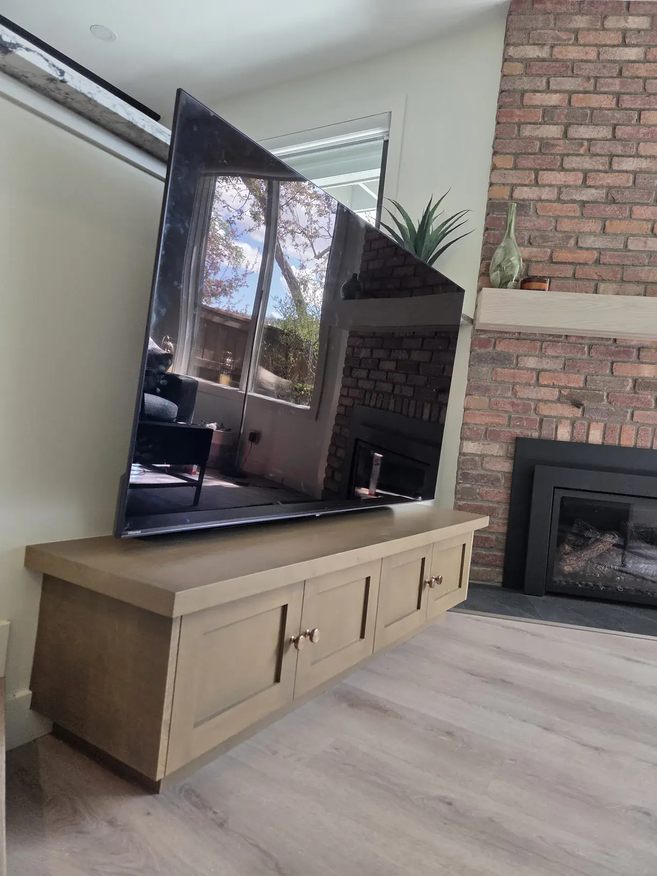 Finished custom mantel, television and cabinet installation