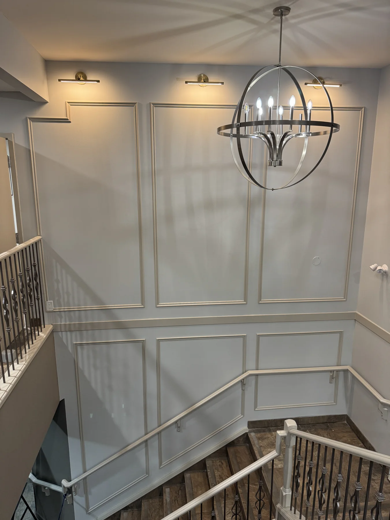 Completed staircase wall paneling with integrated lighting