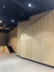 Large sculpted-wood architectural feature wall installed in a Calgary commercial venue.