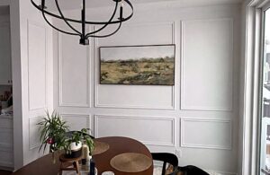 Finished white wall panelling in a furnished Calgary dining room.